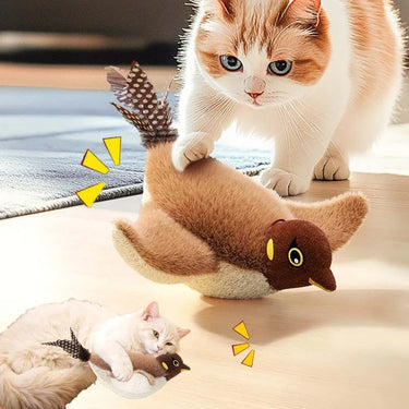 Orange and white cat plays with KittyNook Cat Co.'s Squeaky Plush Cat Toy while another cat cuddles it nearby.